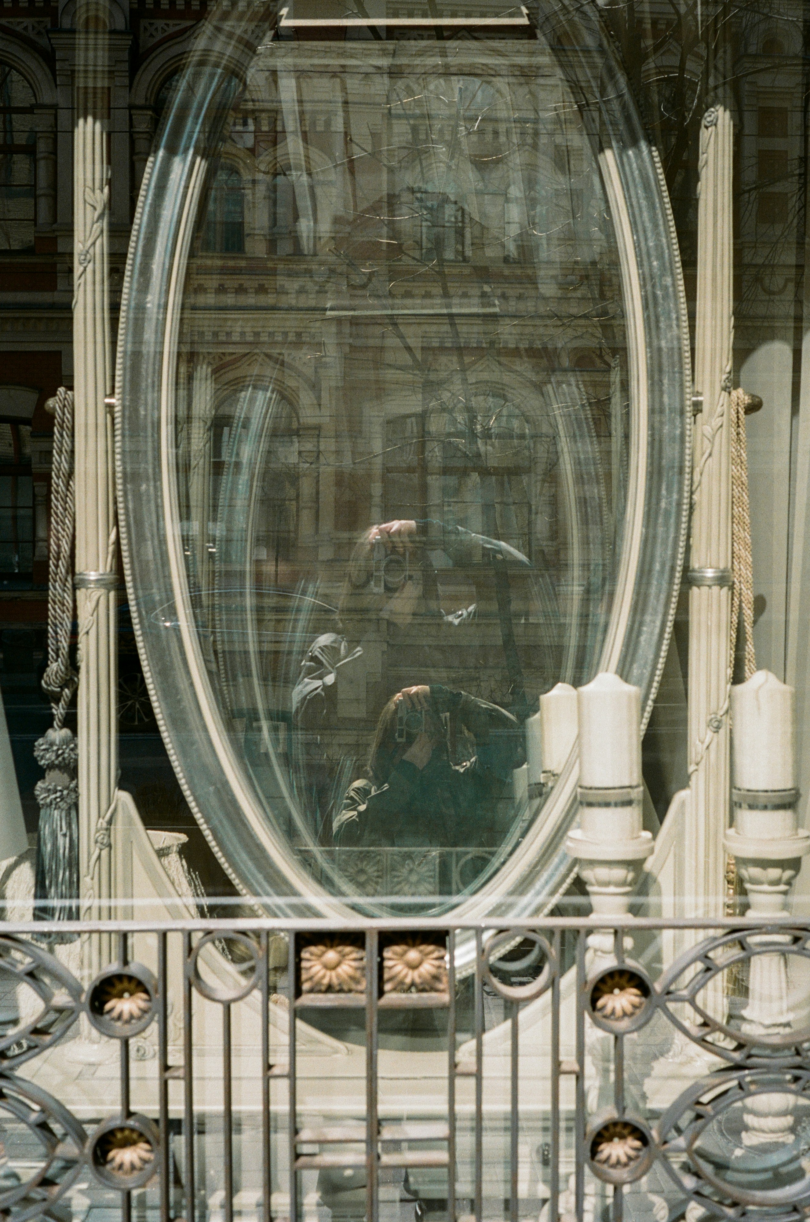 round gray framed glass mirror